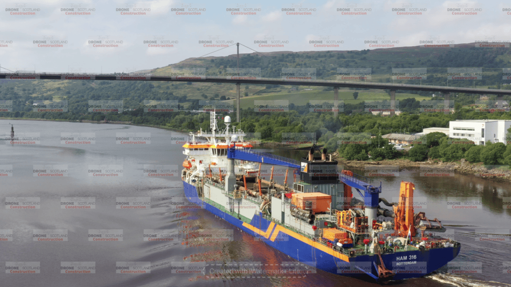 Dredger sailing down the Clyde at Erskine Bridge, Scotland