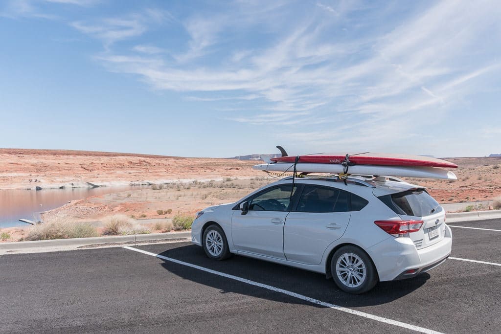 Our Subaru with the rented paddleboards strapped to the top in prep for our trip Paddleboarding on Lake Powell