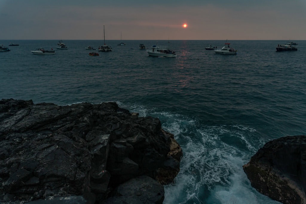 Sun setting through all the VOG in Kona from Ray's on the Bay