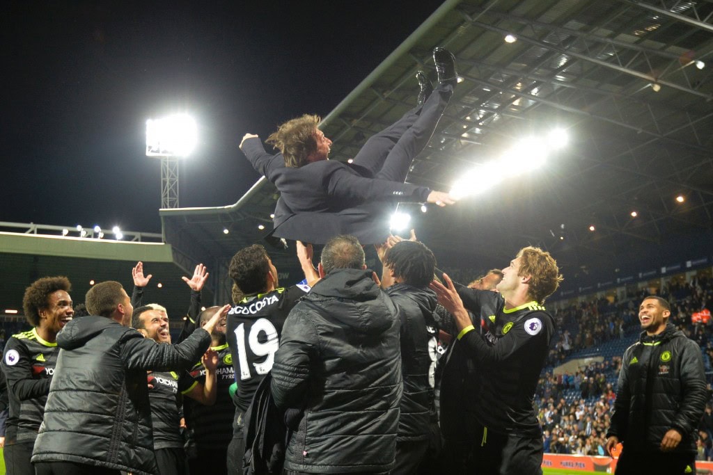 Chelsea's Italian head coach Antonio Conte (top) is thrown in the air by his players as they celebrate being confirmed Premier League champions after the English Premier League match between West Bromwich Albion and Chelsea at The Hawthorns stadium in West Bromwich, west Midlands on May 12, 2017. / AFP PHOTO / Anthony Devlin (Photo credit should read ANTHONY DEVLIN/AFP/Getty Images)