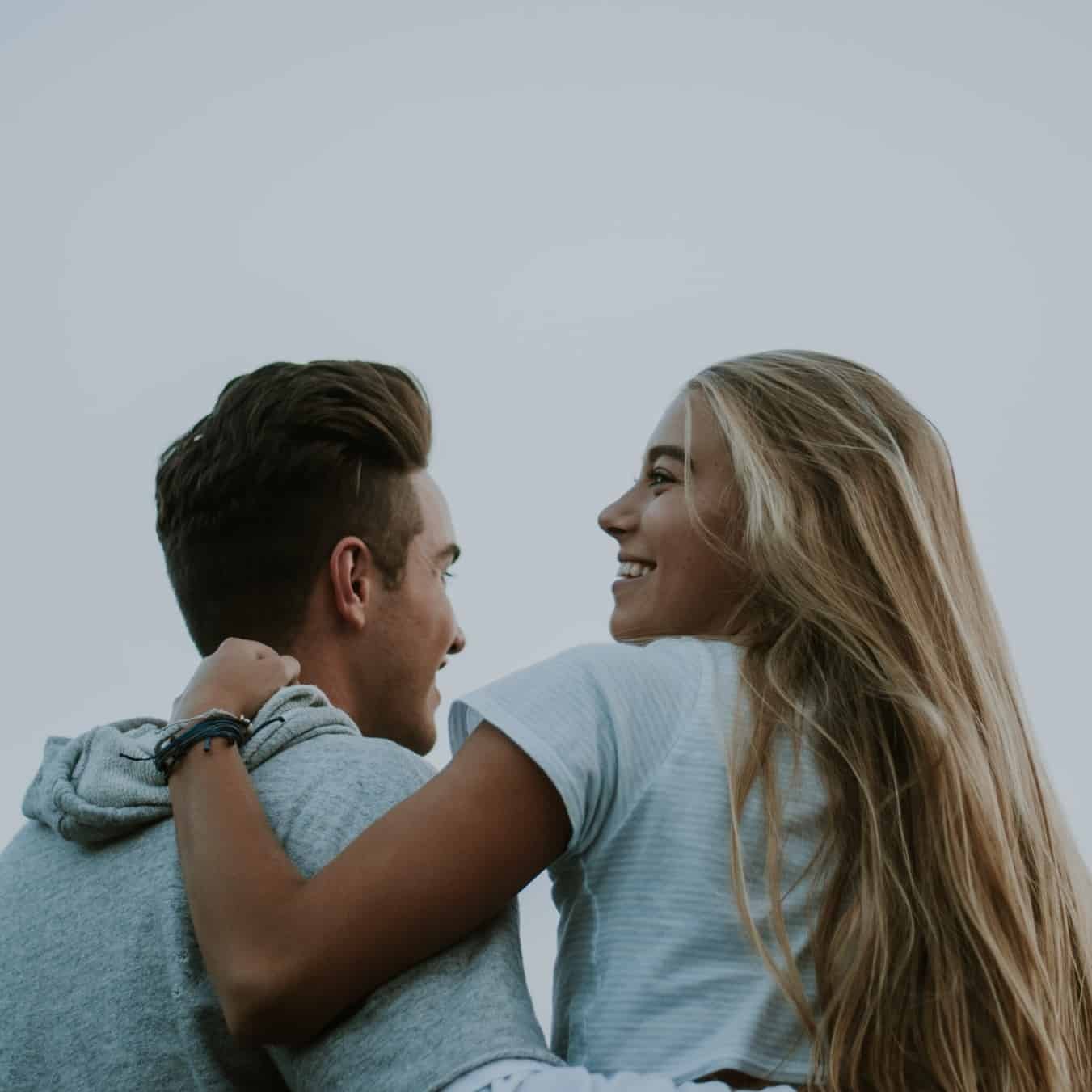 soulmate affirmations2 romantic couple smiling at each other