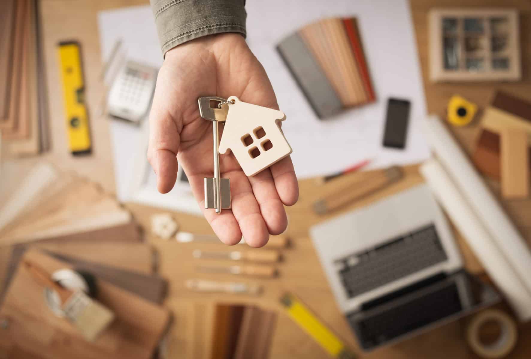 Real estate agent with house key Real estate agent with house key