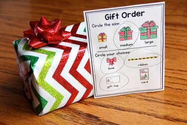 Photo of a Christmas dramatic play center gift with a "gift order" slip where shopper can request gift size and decorations.