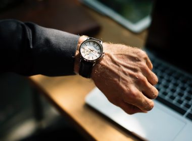 man looking at watch