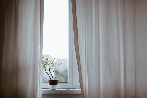 self care self isolation curtain slightly open