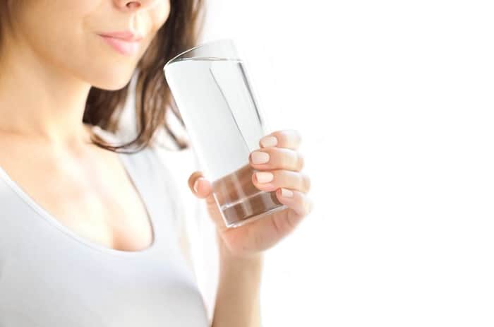 two cup method 2 woman drinking glass of water