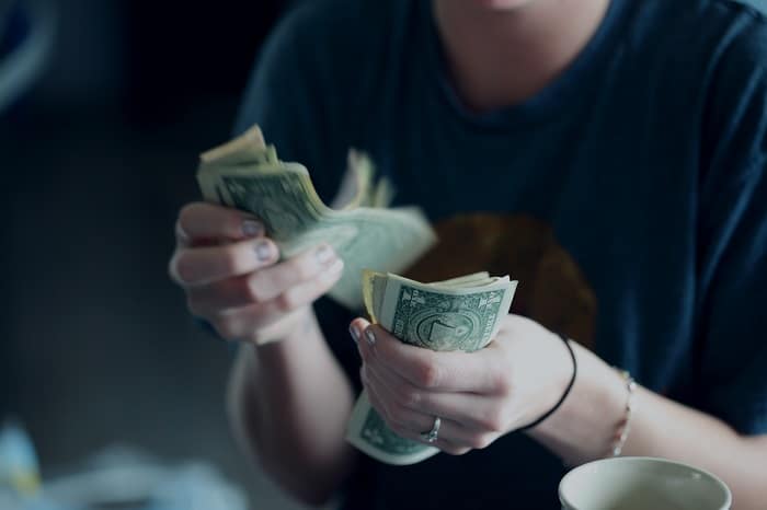 financial boundaries person counting money