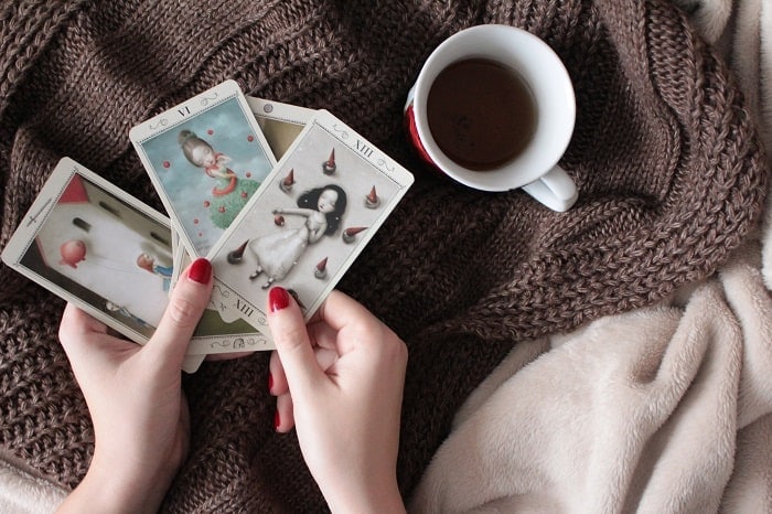 tarot numerology person reading tarot