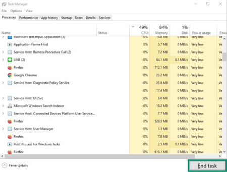Windows Task Manager with the End task button highlighted.