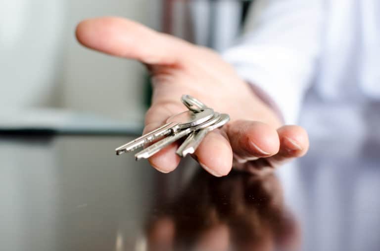 Estate agent showing house keys Estate agent showing house keys