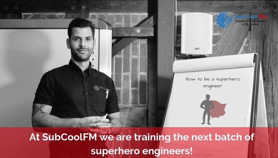 Jacob stood in front of a flip chart that reads "How to be a superhero engineer"