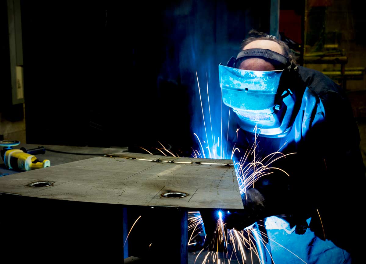 spot-welding-spike-electric Man spot welding at Spike Electric in Houston, TX
