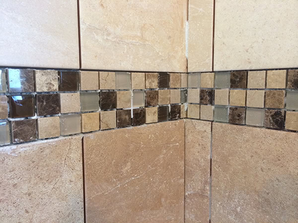 Cleaning Out Adhesive From Mosaics Prior To Grouting With Bathroom Installation In Leeds