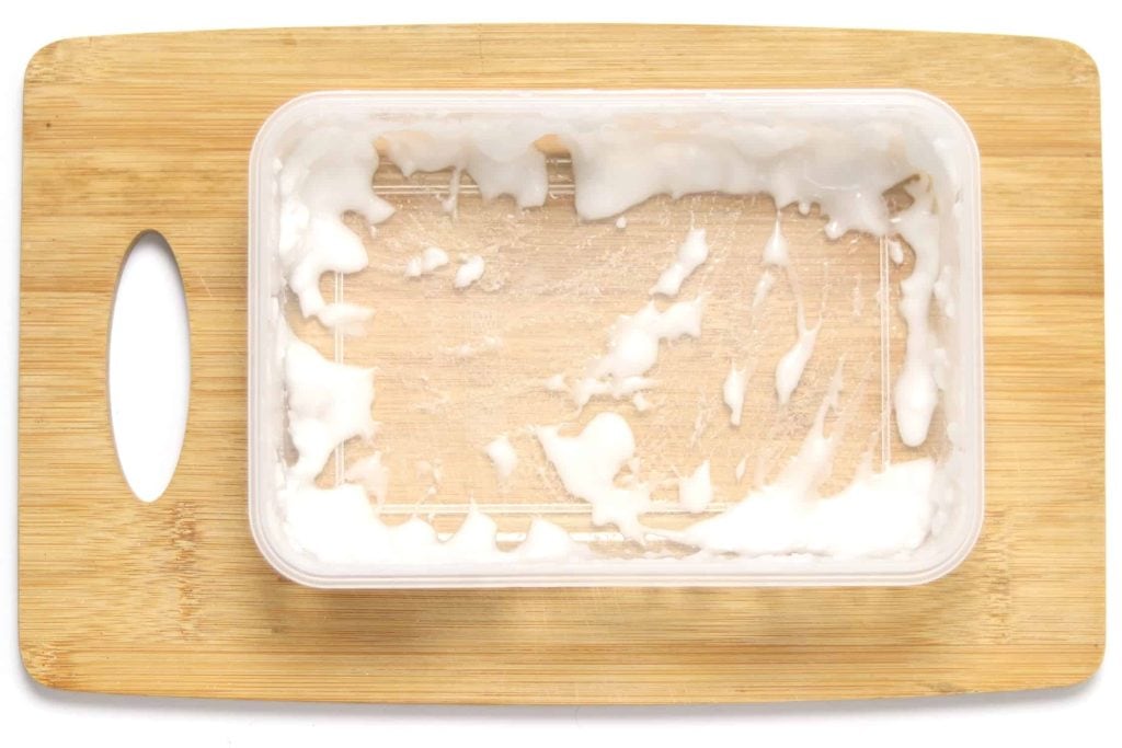 plastic container rubbed with a baking soda paste