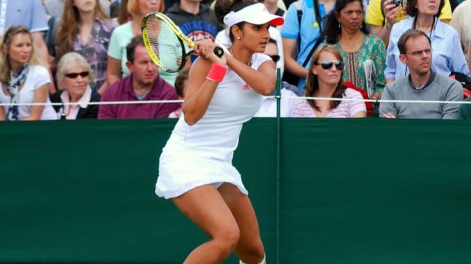 Sania_Mirza_during_her_first_round_match_with_Virginie_Razzano,_Day_2_of_Wimbledon_2011