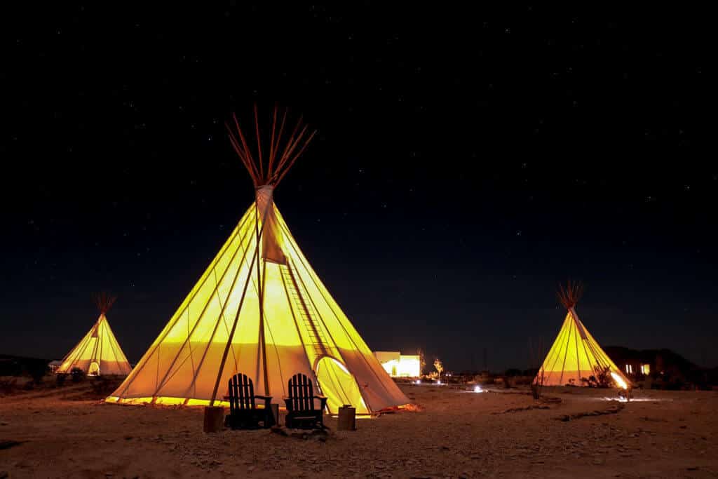 Tipis at night.