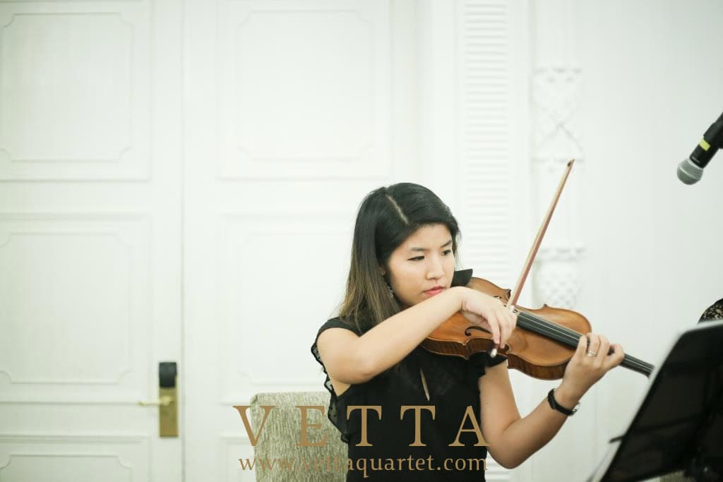 String Violinist playing cocktail music at Fullerton Hotel