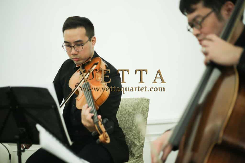 String Quartet Violist and Cellist playing background music at corporate booking Fullerton Hotel Singapore
