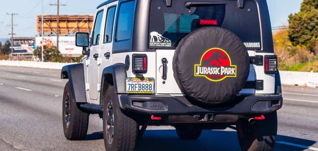 Jeep Wrangler with Tires in a road