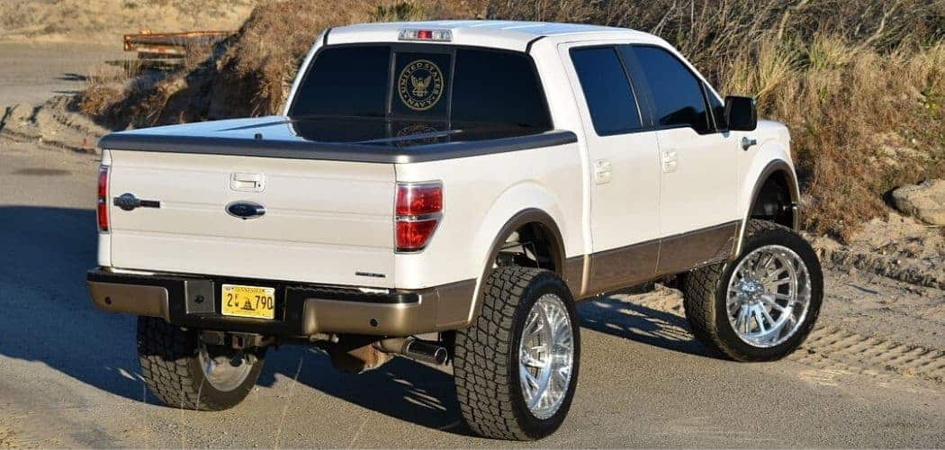 lifted white ford f150 with tonneau cover