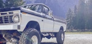 truck installed with shocks with mountain background