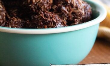 Close shot of chocolate coconut macaroons in a bowl with text overlay for Pinterest on yellow accent.