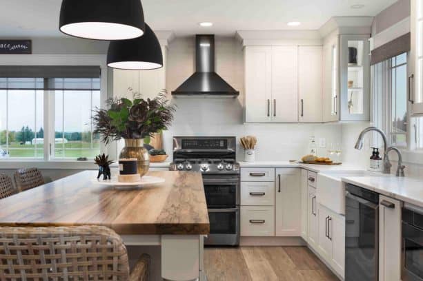 all white cabinet open space modern farmhouse kitchen and dining room combo with black appliances