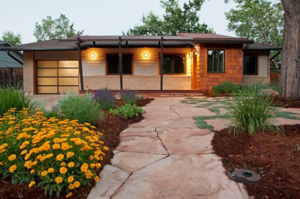 flagstone-made front walkway landscaping idea with ornament of xeric flower beds