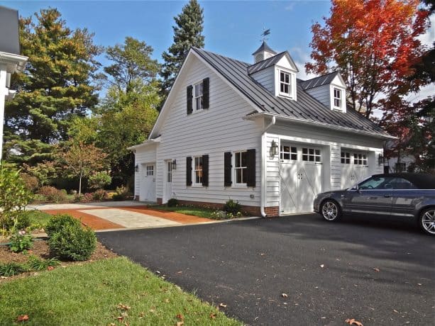 timeless three-car white garage apartment with englart metal black roof