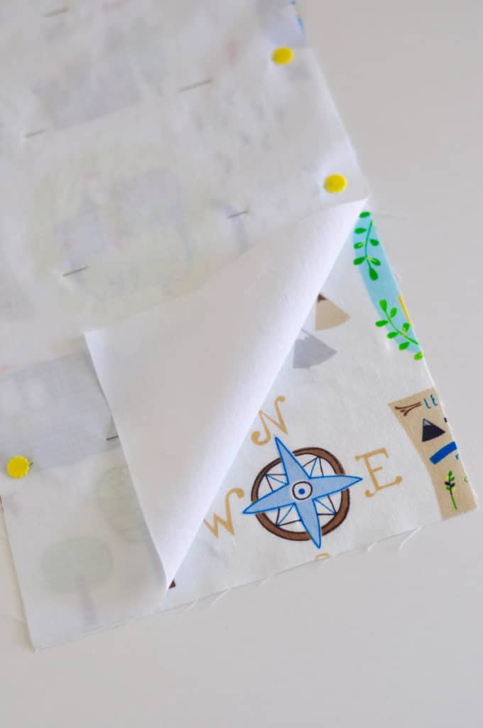 Fabric is shown being pinned right sides together.