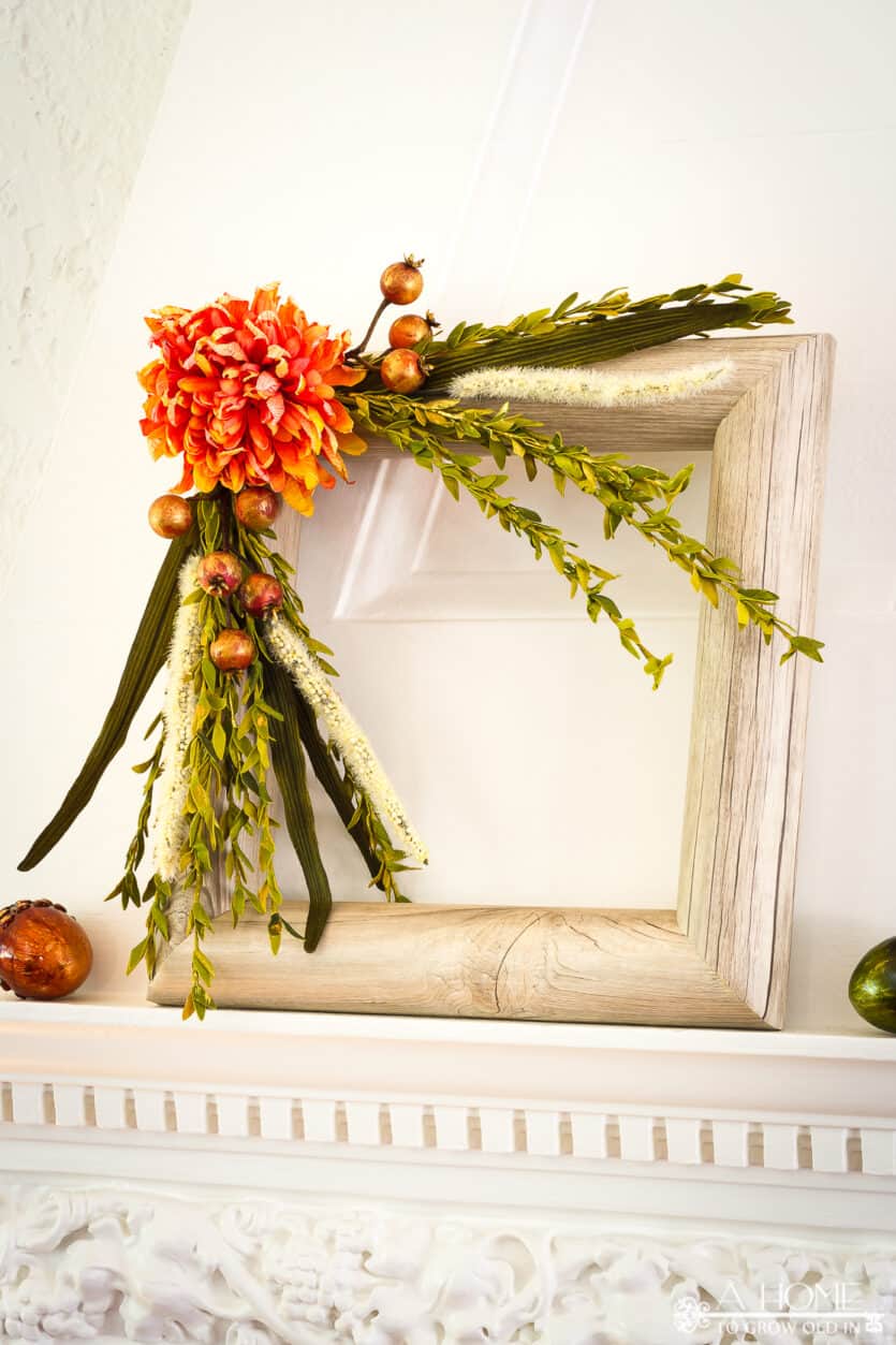 square fall pool noodle wreath on a fireplace mantel