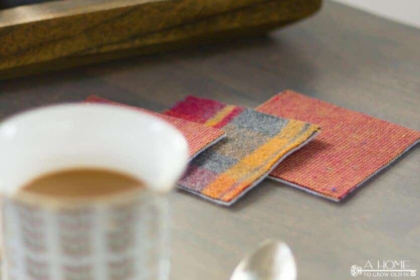 plaid flannel drink coasters on a coffee table with a cup of coffee