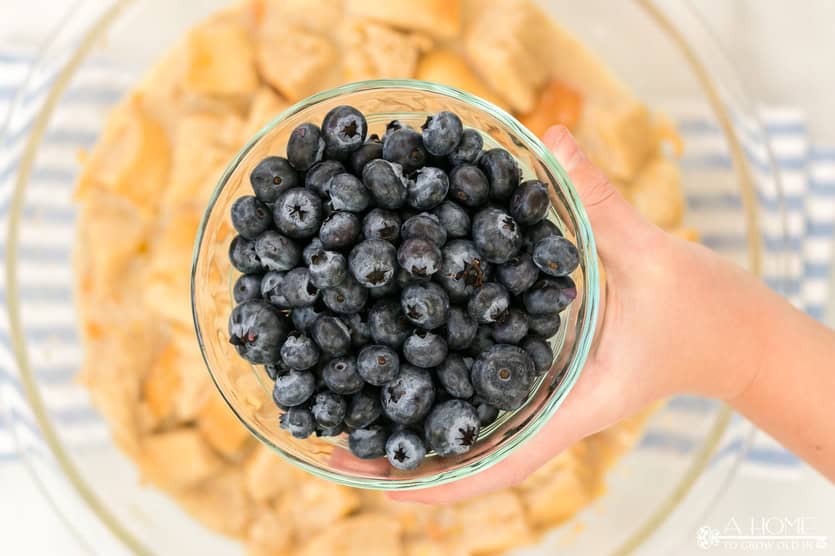 blueberries getting added to bread pudding