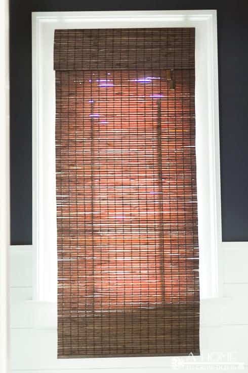 This is a great tutorial on where to buy inexpensive bamboo shades for any size window and how to easily shorten them to get a custom made look. Pin it so you don't forget it!