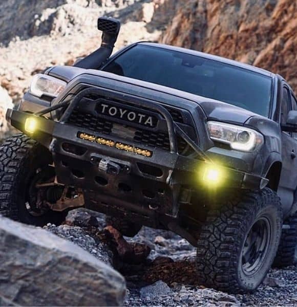 toyota black truck with shocks