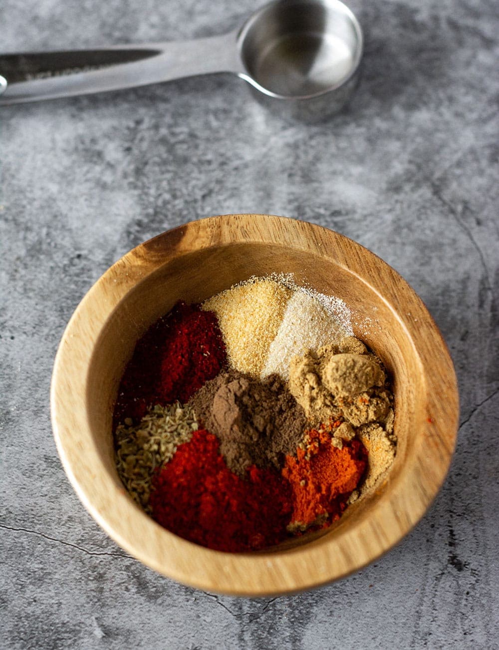 chili powder in wooden bowl