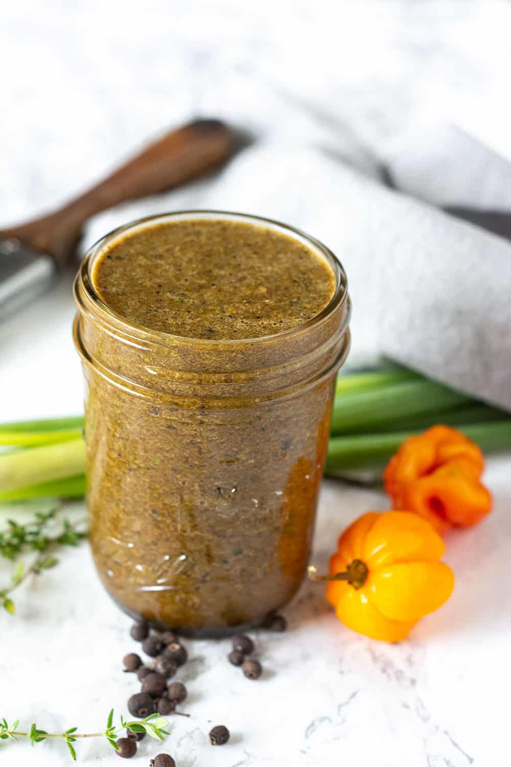 Jerk Sauce in a glass jar on a white background