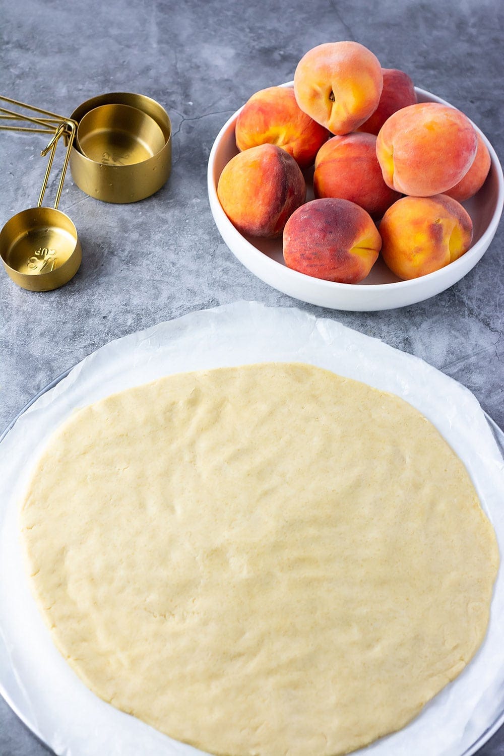 Ingredients for peach galette, pie crust, peaches