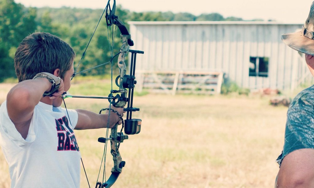kid shooting bow