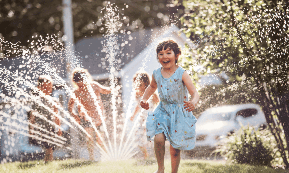 kids playing in sprinkler
