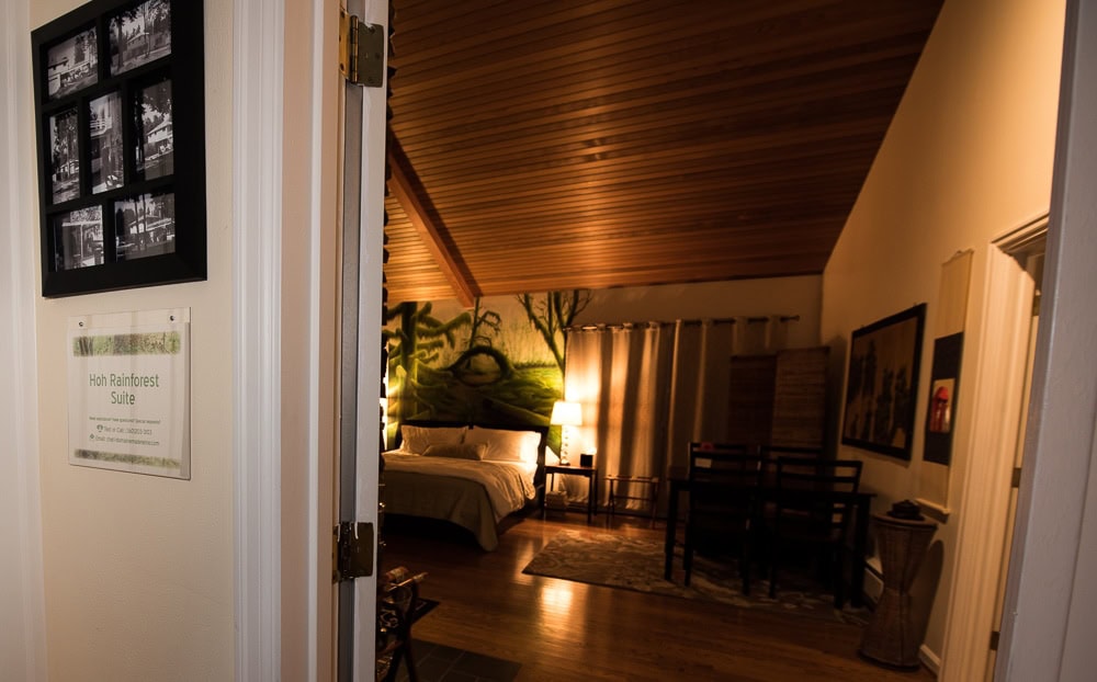 Looking into the HoH Rainforest Suite at Domaine Madeleine from the shared space in the main house.