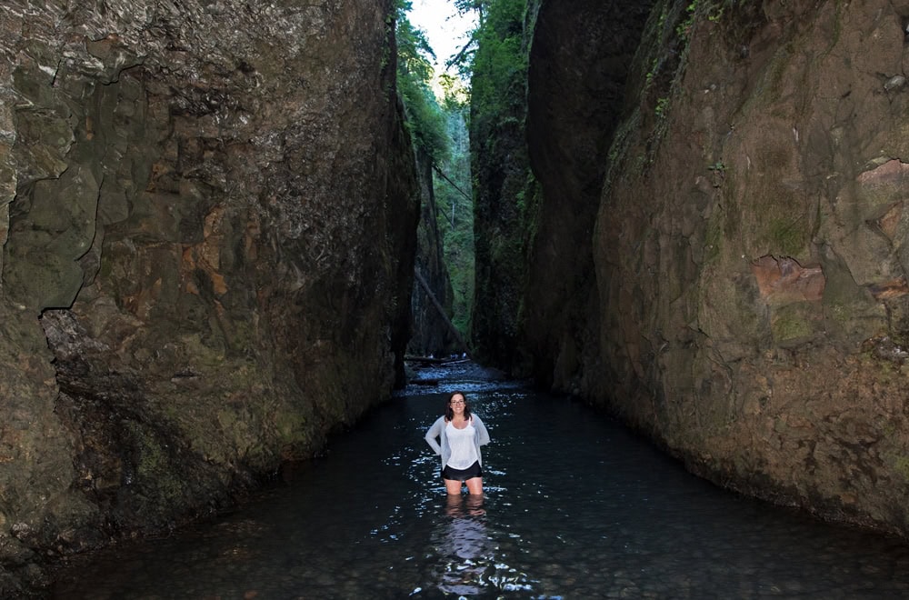 Brooke posing in the water of the oneonta gorge