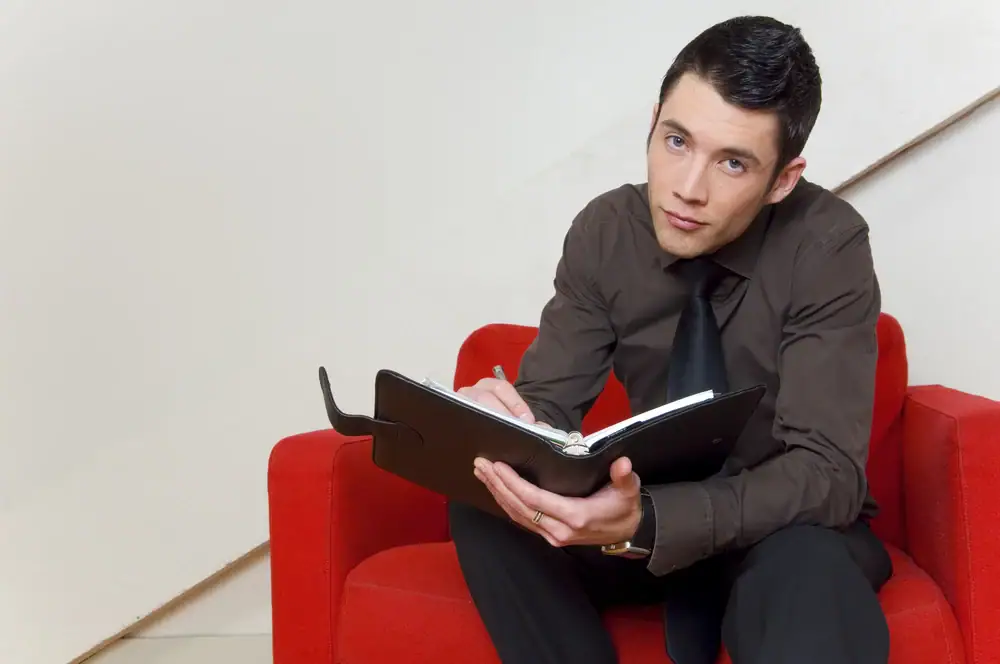 A young adult using a planner to create a routine to help with executive functioning