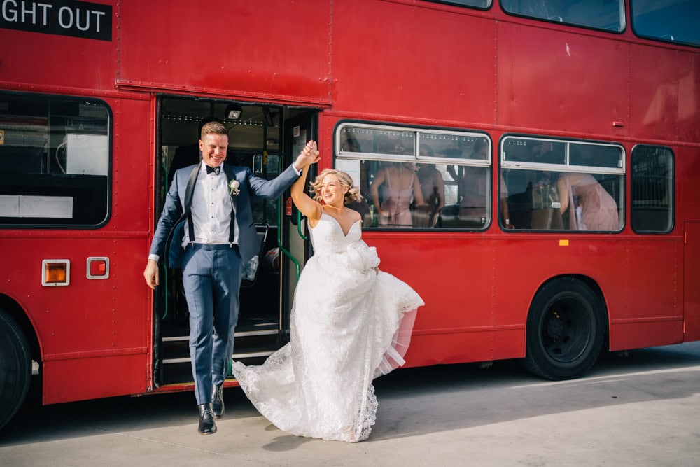 bride and groom stepping off big night out bus