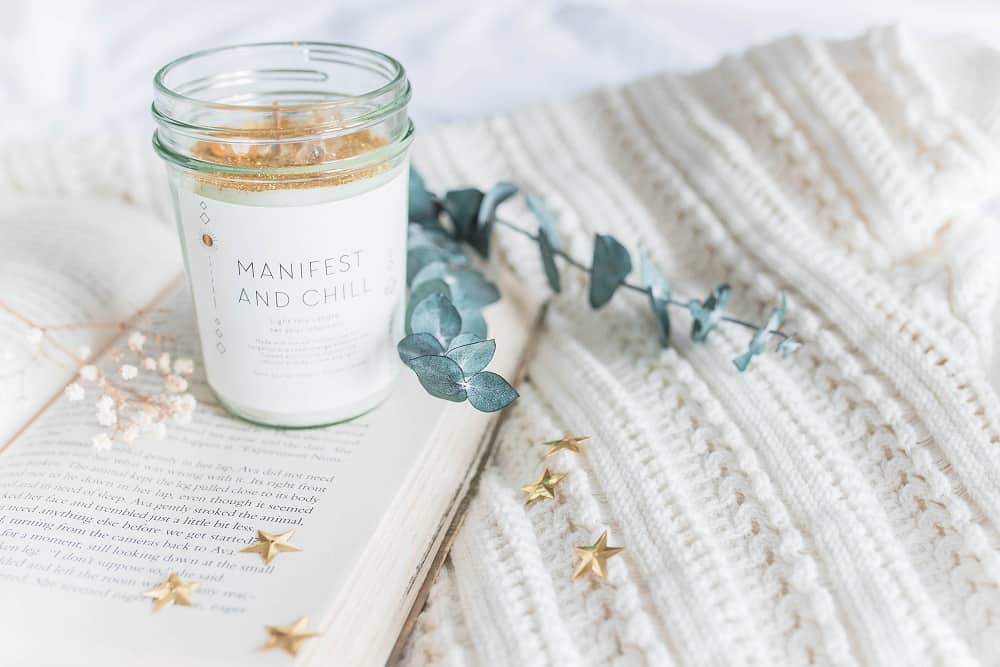 manifest and chill candle and book