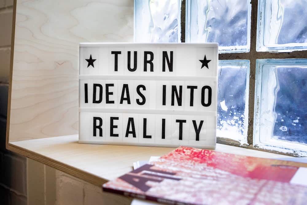 sign that reads "turn ideas into reality"