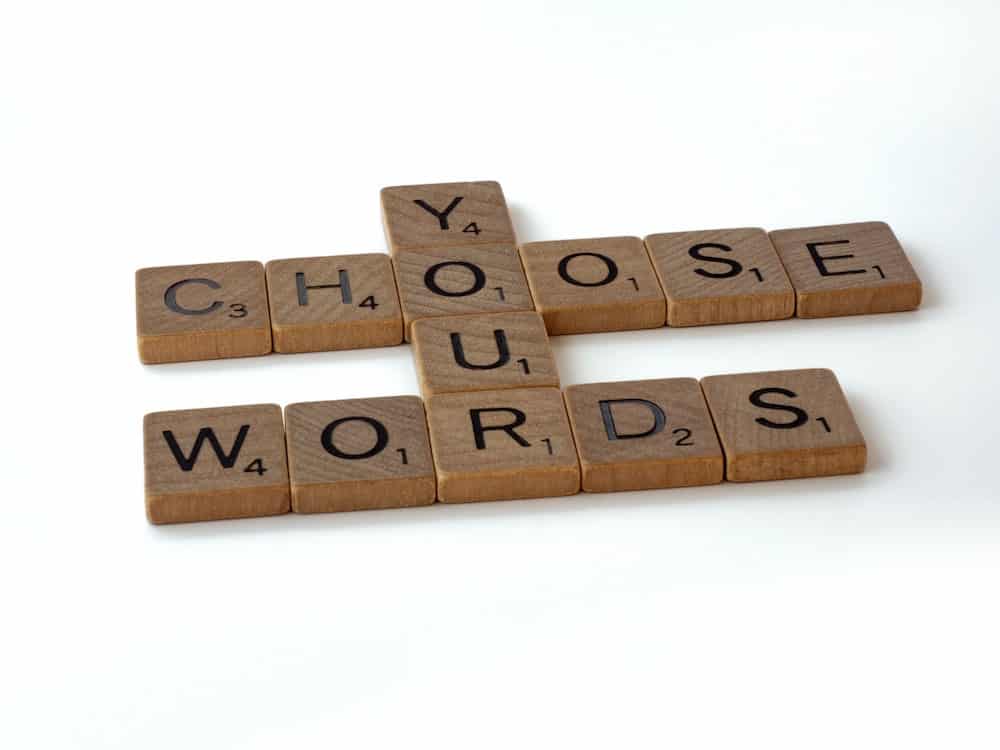 scrabble letters arranged to read "you choose your words"