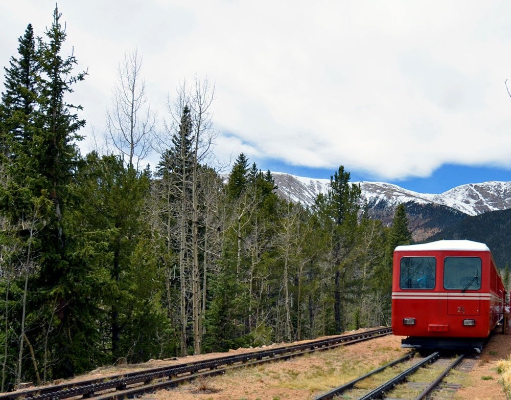 The Pikes Peak Cog Railway at the stopping point surrounded by trees