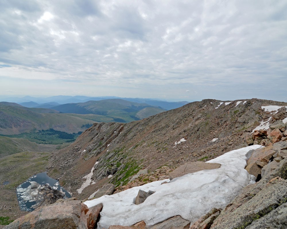 Snow on the mountain side during the hike to Mt. Bierstadt in summer.