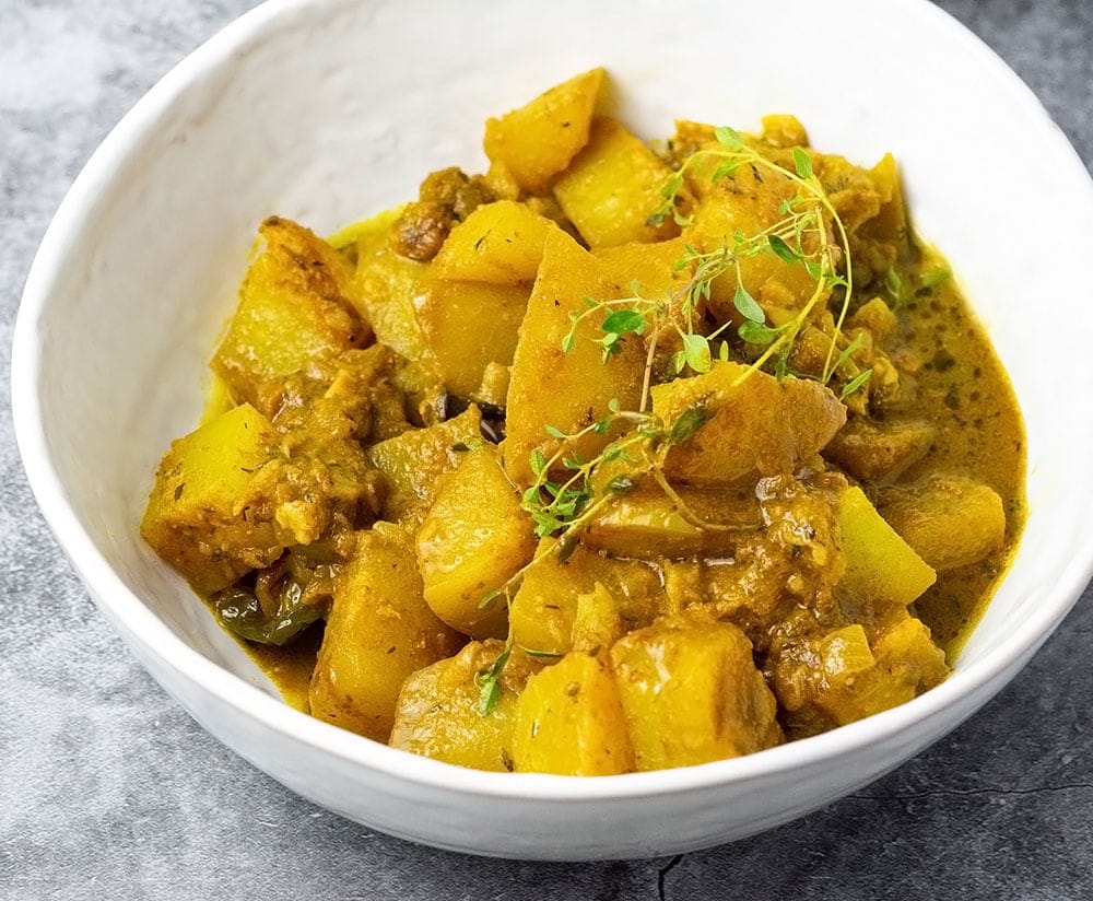vegan jamaican chayote curry in a white bowl